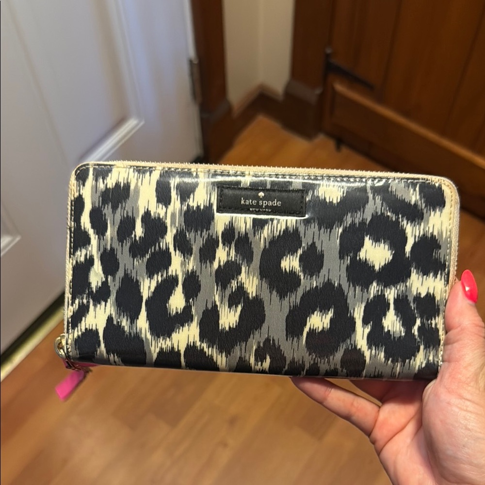 Kate Spade wallet. Cheetah print with pink zipper.